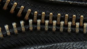 Close-up of a vintage metal zipper on a leather jacket. ASMR video - Powered by Shutterstock - Get 15% off with code: PIKWIZARD15