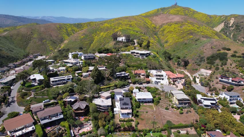 Ventura - 6.24.2024 - wonderful aerial footage moving over housing up a hillside in sunny ventura, california.