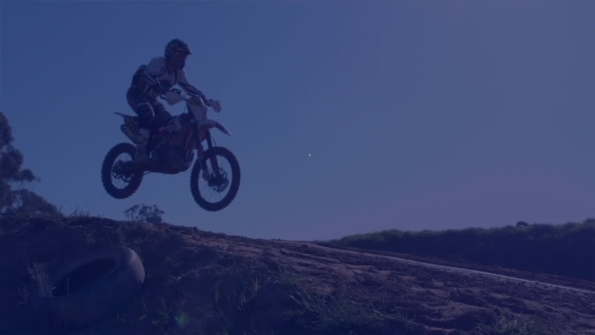 Motorcyclist jumping over hill with digital clock animation overlay. Motorcycle, stunt, extreme, sports, adrenaline, action