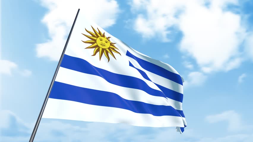 The video shows the Uruguayan national flag waving in the wind. The flag features horizontal stripes of white and blue, with a golden sun in the top left corner, set against a clear blue sky. - Powered by Shutterstock - Get 15% off with code: PIKWIZARD15