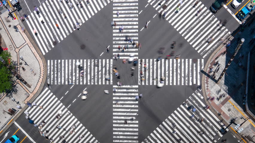 Time lapse video from above Ginza Crossing in Tokyo, Japan. Witness the bustling intersection as people and cars move through this iconic Tokyo crosswalk. Perfect for capturing Tokyo's vibrant urban - Powered by Shutterstock - Get 15% off with code: PIKWIZARD15