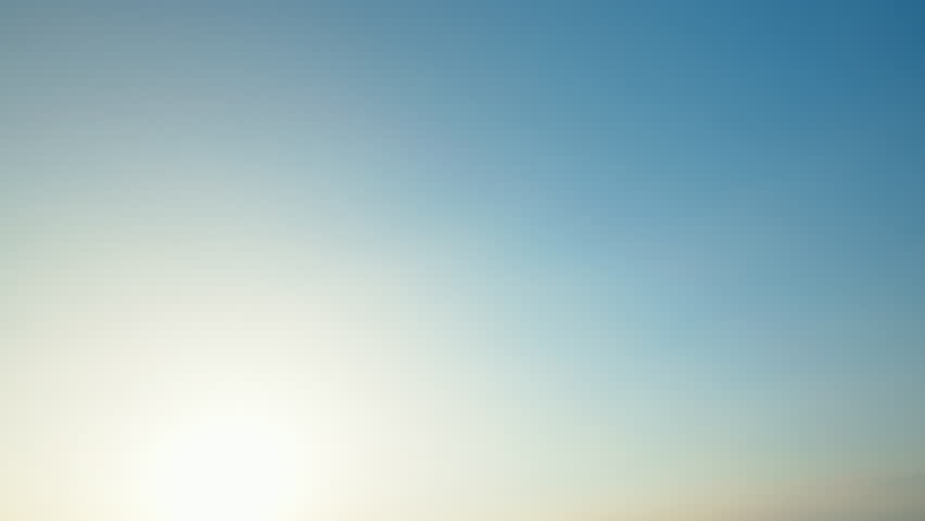 Hand girl holding paper airplane flies against  blue sky slow motion close up. Hand holds handmade craft paper airplane against sunset. Lifestyle. Freedom. Travel concept. Tourism.