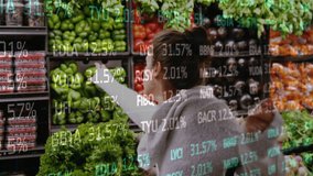 Picking vegetables in grocery store, financial data animation over fresh produce. shopping, market, healthy, organic, finance, economy - Powered by Shutterstock - Get 15% off with code: PIKWIZARD15