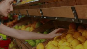 Stock market data animation over woman selecting produce in grocery store. Economy, finance, stock exchange, investments, trading, shopping - Powered by Shutterstock - Get 15% off with code: PIKWIZARD15