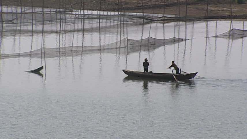 Fishermen in river