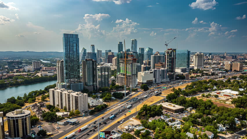 Aerial Time-Lapse of Downtown Austin Skyline - Adjacent the I-35 Highway and Lady Bird Lake (6K to 4K)