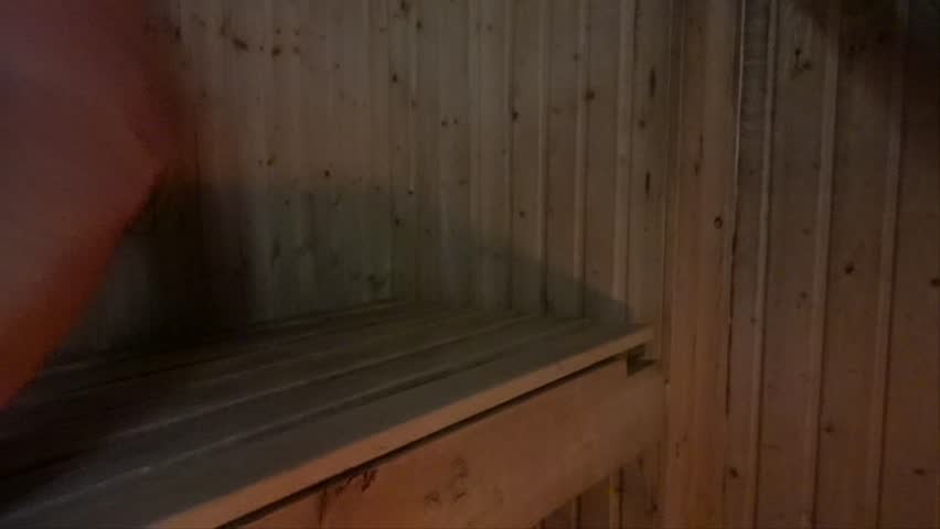 Stockholm, Sweden A middle-aged man enjoys a hot sauna.