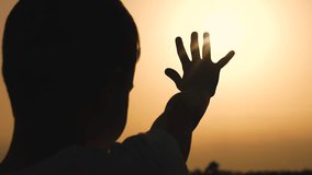 boy son child hand prayer sun ask to pray sky man faith, happy family, children's dream, boy praying silhouette, child seeking hope, son sunset faith, young hand sky, kid sun worship, little boy - Powered by Shutterstock - Get 15% off with code: PIKWIZARD15