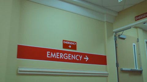 Patient point of view of a hospital hallway leading to the emergency room
