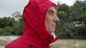 Man Taking Off The Raincoat Hood  - Powered by Shutterstock - Get 15% off with code: PIKWIZARD15