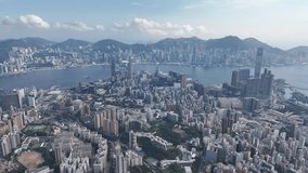 Aerial shots capturing Hong Kong Kowloon Peninsula Tsim Sha Tsui harbourfront with Harbour City, iconic Victoria Harbour and  Central Admiralty Wan Chai skyline backdrop - Powered by Shutterstock - Get 15% off with code: PIKWIZARD15
