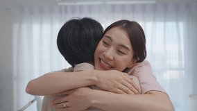 Asian romantic man making surprise proposal of marriage to girlfriend. Attractive young male proposing to beautiful happy woman with wedding ring enjoying surprise engagement in living room at home. - Powered by Shutterstock - Get 15% off with code: PIKWIZARD15