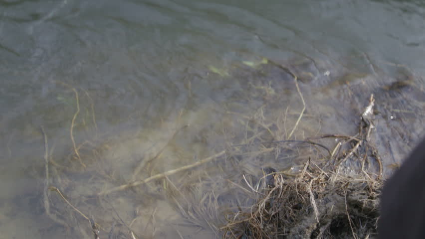 Cowboy filling up his canteen.