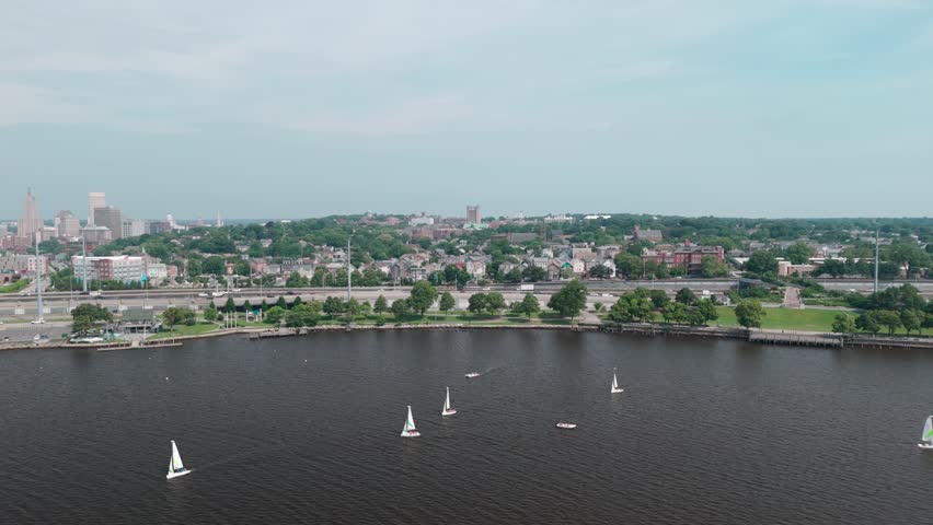An aerial footage of boats sailing in Providence River on a sunny day in Providence City, Rhode Island, United States