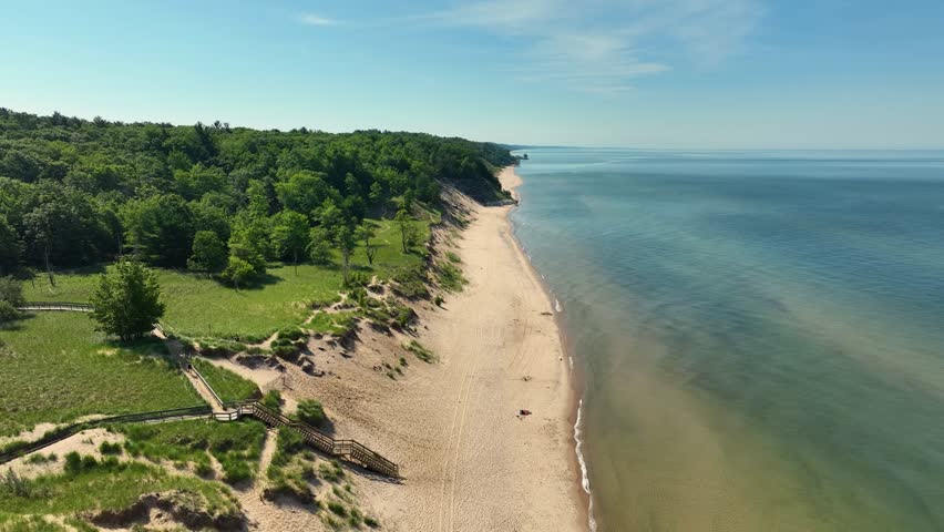 Reverse track, pulling along the winding sand dunes and shoreline.