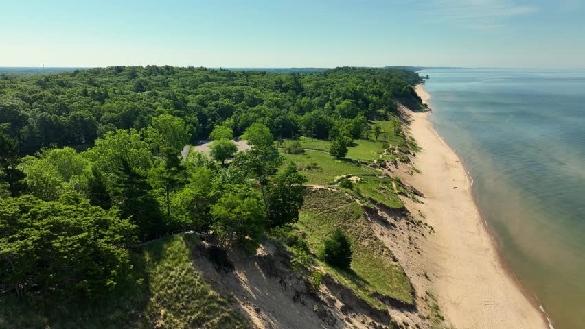 Tilting up to show the coastline of Lake Michigan.