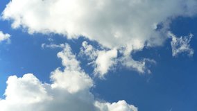 Floating fluffy clouds. Beautiful sunny blue sky with wispy smoky white cumulus and cirrus on different layers. Timelapse. - Powered by Shutterstock - Get 15% off with code: PIKWIZARD15