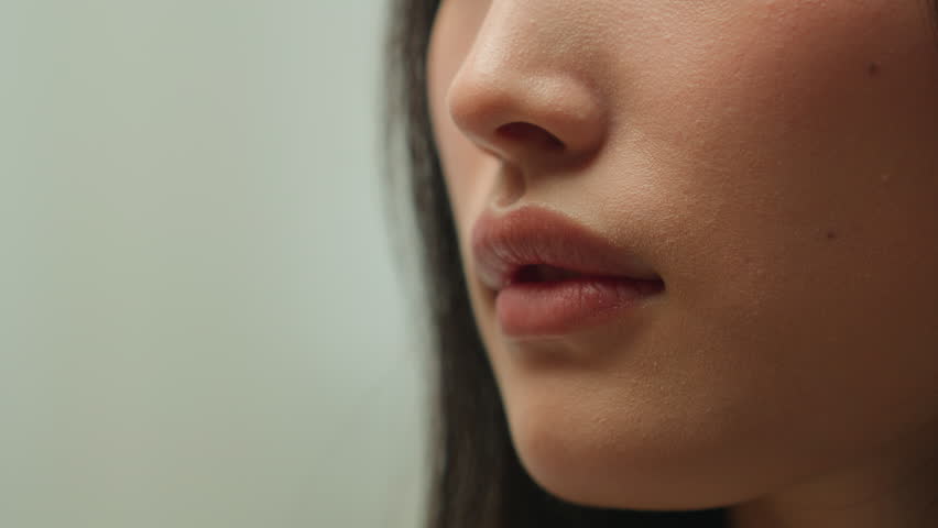 Extreme close up Asian woman chinese girl unrecognizable female smelling flower blossom fresh aroma fragrance natural organic cosmetics skin care cosmetology beauty smell floral perfume health medical