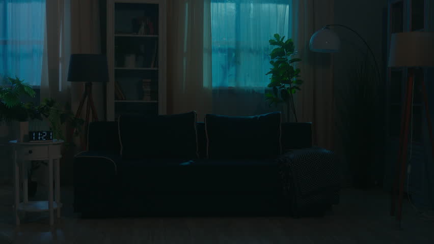 Smart home lighting system woman walking in dark room distant turning lightness electricity modern futuristic house night female girl homeowner use mobile phone turn lights on smartphone easy control
