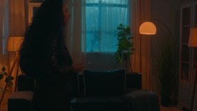 Smart home lighting system woman walking in dark room distant turning lightness electricity modern futuristic house night female girl homeowner use mobile phone turn lights on smartphone easy control - Powered by Shutterstock - Get 15% off with code: PIKWIZARD15