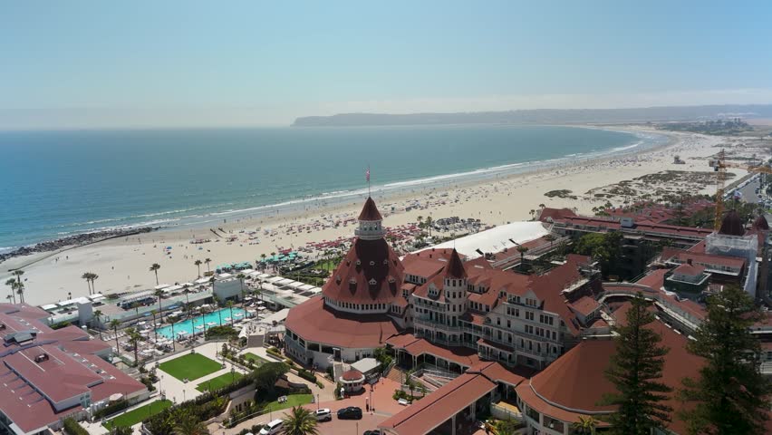 The Iconic California Beach Resort With Hotel del Coronado Across San Diego Bay, California USA. Aerial Shot