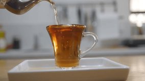 The kettle, gleaming with a polished metallic sheen, emits a soft whistle as it reaches the perfect temperature. A plume of steam curls gracefully from its spout, dissipating into the air. - Powered by Shutterstock - Get 15% off with code: PIKWIZARD15