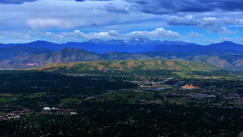 Summer Denver Colorado aerial drone Golden Arvada Lakewood cloudy front range foothills landscape Mount Blue Sky Red Rocks Amphitheater neighborhood homes blue skies clouds forward pan reveal motion