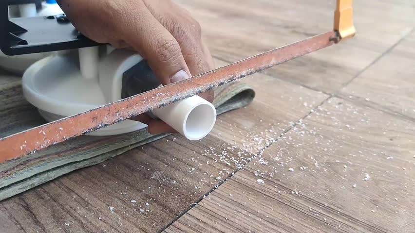 activity of cutting pipe with hacksaw