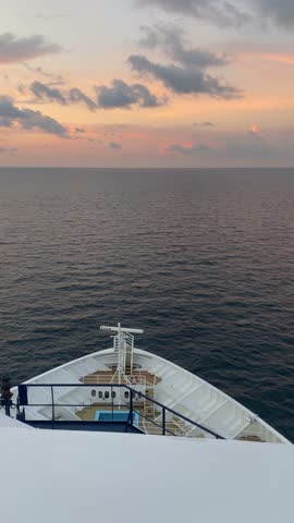 Cruise Ship Sailing On The Ocean At Sunset