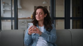 Caucasian woman girl female lady user at home couch sofa relaxing gadget addict social media internet addition using mobile phone chat smartphone browsing smiling happy order shopping cellphone app - Powered by Shutterstock - Get 15% off with code: PIKWIZARD15