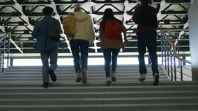 View from behind university back to school college pupils students people girls guys boys women female male men classmates friends teenagers climb up run running stairs education studying rush hurry - Powered by Shutterstock - Get 15% off with code: PIKWIZARD15