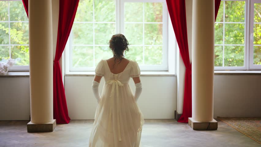 young woman is running in room looking out the window, waiting for love beloved man. Fantasy fairy lady Happy Princess girl, white silk vintage long dress old style ivory color back rear view. art 4k.