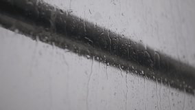 Raindrops falling on the balcony glass, raindrops sliding off the glass, - Powered by Shutterstock - Get 15% off with code: PIKWIZARD15