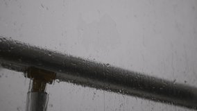 Raindrops falling on the balcony glass, raindrops sliding off the glass, - Powered by Shutterstock - Get 15% off with code: PIKWIZARD15