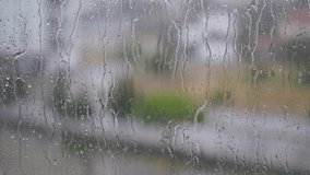 Raindrops falling on the balcony glass, raindrops sliding off the glass, - Powered by Shutterstock - Get 15% off with code: PIKWIZARD15