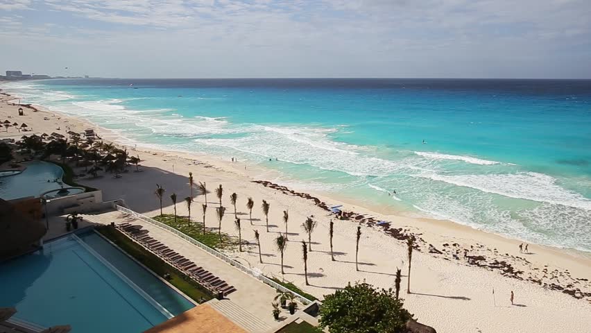 Aerial view of tropical beach of a luxury resort with white sand on a bright sunny day, Summer vacation on travel destination