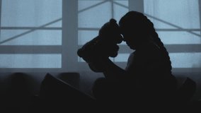 Depressed Kid holds teddy comfort from problems. Kid with teddy bear quiet solace amidst tears. Solace for child facing problems. Depressed Kid finds listener in teddy bear. Child in tough times. - Powered by Shutterstock - Get 15% off with code: PIKWIZARD15