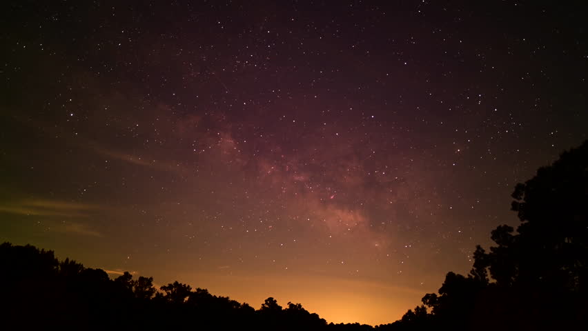 Time lapse of rising Milky Way, clouds passing