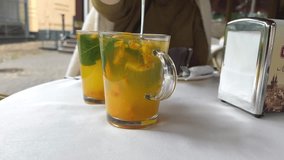 Hot autumn tea with sea buckthorn, ginger and mint in a glass teapot on a gray background - Powered by Shutterstock - Get 15% off with code: PIKWIZARD15