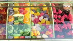 colorful candy sweet jelly in a glass jar displaying at candy shop  - Powered by Shutterstock - Get 15% off with code: PIKWIZARD15