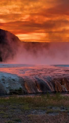 Vertical View of Beautiful Sunset Sky Above Yellowstone National Park, Vapors From Hot Springs and Geothermal Water