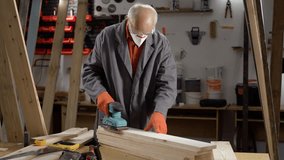 Sanding, wood and carpenter. service and renovation in carpentry workshop. Maintenance, handyman with belt sander - Powered by Shutterstock - Get 15% off with code: PIKWIZARD15