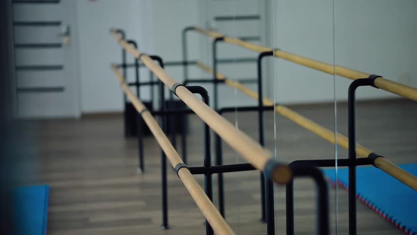 Close-up of ballet bars near mirrors