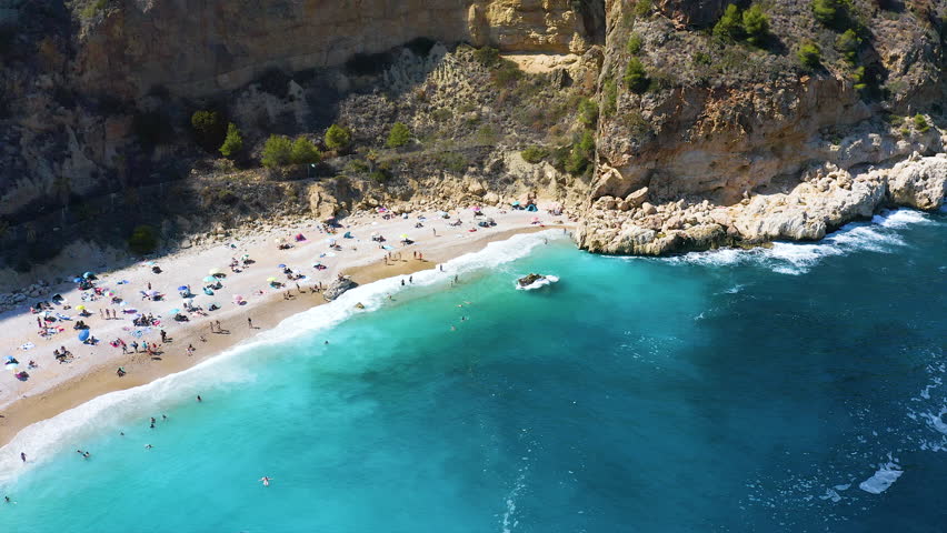 Aerial view of the wonderful Cala del Moraig , located between the beautiful cliffs of the town of Benitachell, in the Mediterranean province of Alicante, Spain.