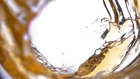 Slow motion White grape Juice pours into a glass forming a beautiful wave. High quality 4k footage - Powered by Shutterstock - Get 15% off with code: PIKWIZARD15
