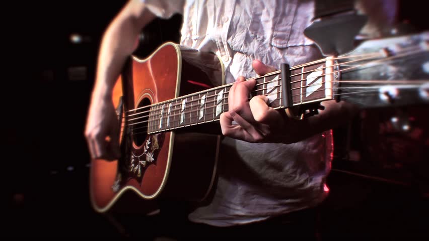 acoustic guitar player on stage