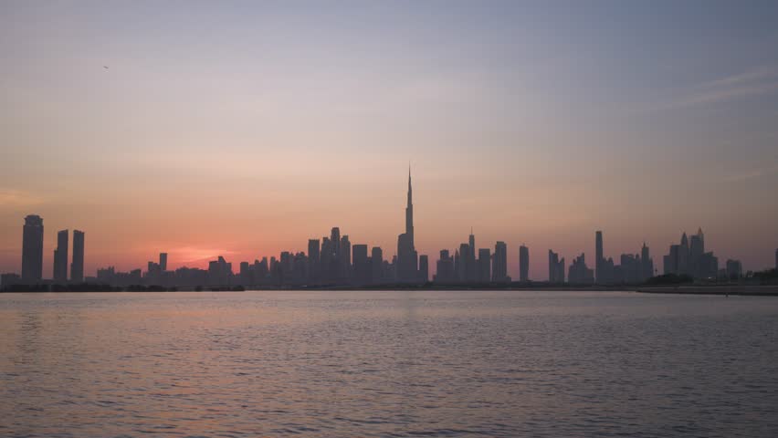 Aerial view of Dubai skyline at sunset, United Arab Emirates.