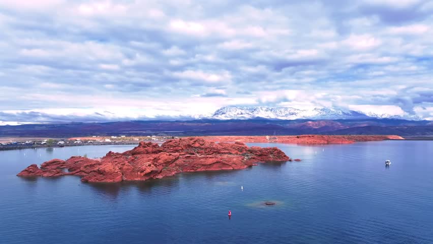 Aerial view of the Sand Hollow State Park at Greater Zion desert with the snowy mountains in the background