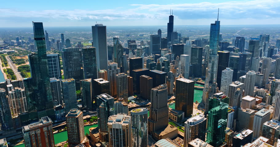 Rising over the downtown of modern Chicago. Splendid vast scenery of metropolis on sunny day from top.