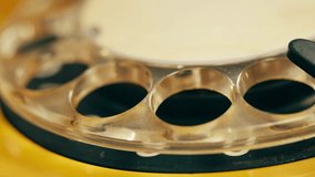 Retro vintage phone, A yellow rotary telephone is displayed on a wooden desk, adding a nostalgic touch - Powered by Shutterstock - Get 15% off with code: PIKWIZARD15